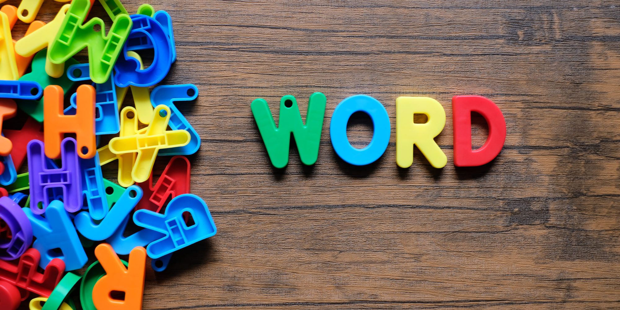 'Word' colorful word on the wooden background